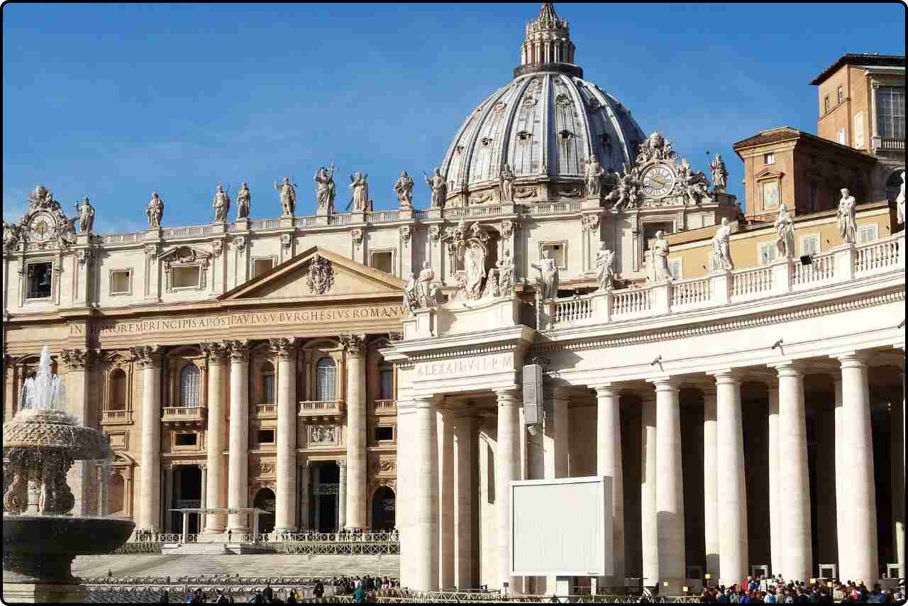 The iconic beige buildings on St. Peter's Square, showcasing their historic architecture in Vatican City.